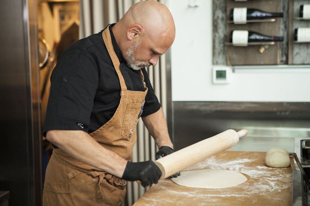 Chef David rolling dough